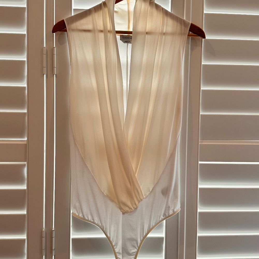 Brand new cream colored body suit